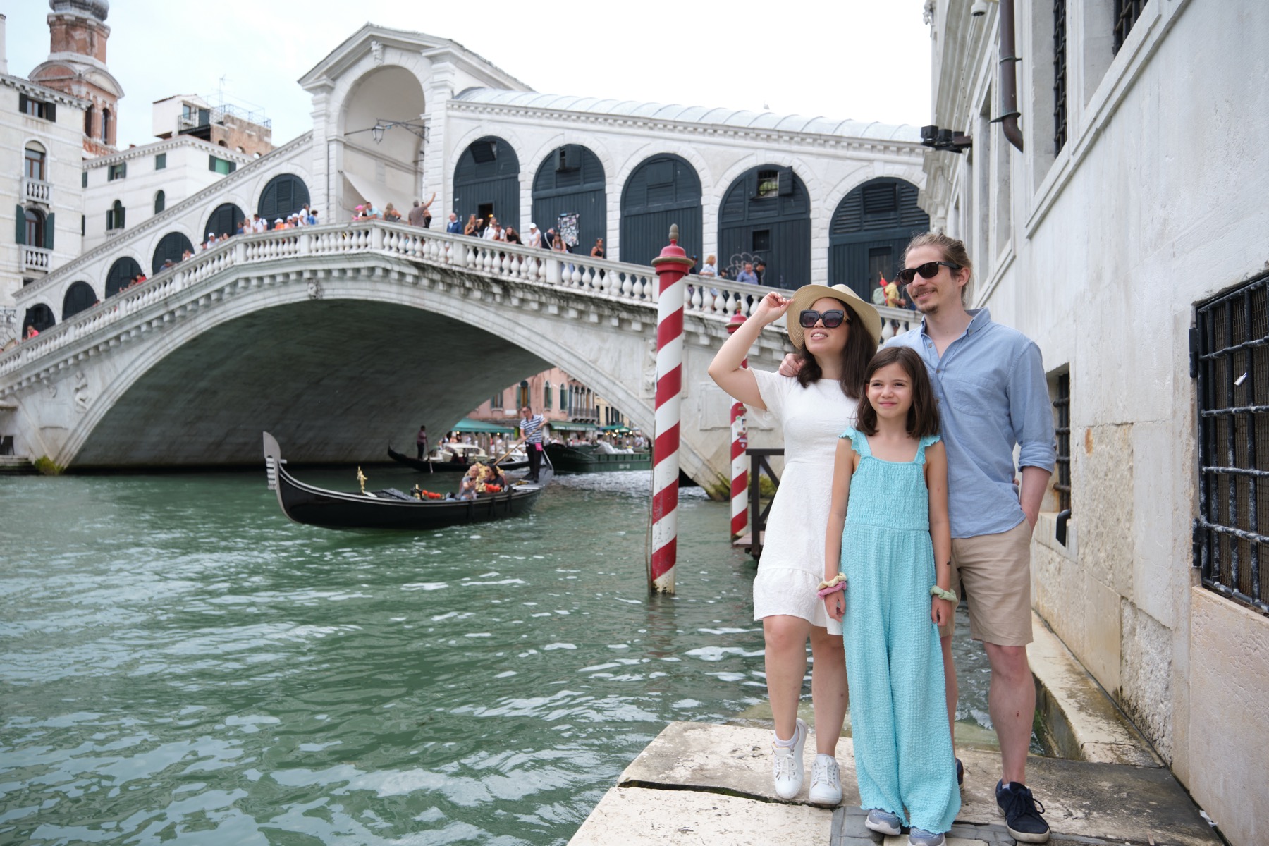 Family portrait beside the Rialto Bridge in Venice